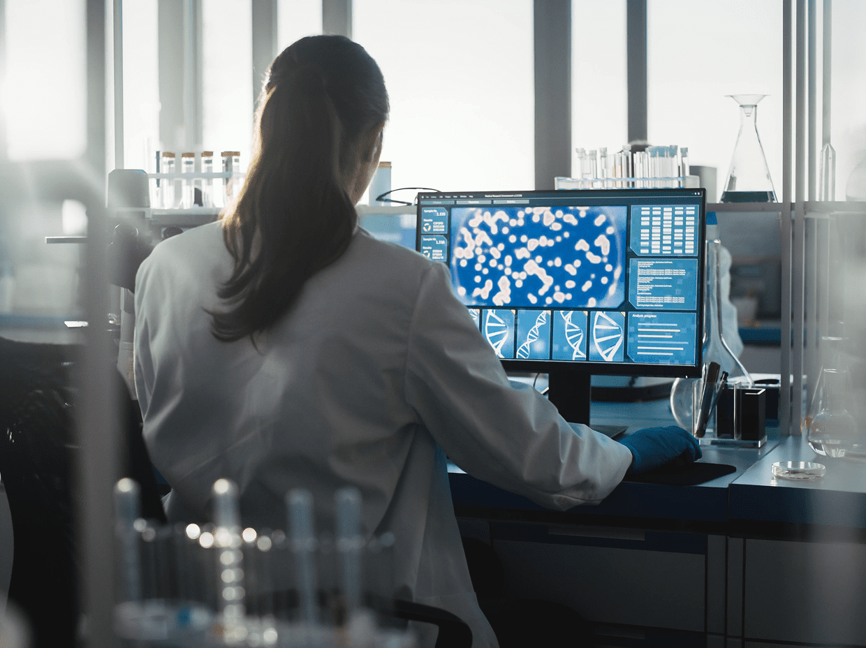Scientist analyzing data on computer screen.