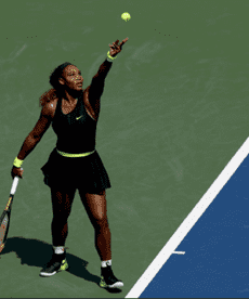 Portrait of a man smiling gently against a teal background.